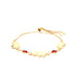 The Red Evil Eye Elephant Charm Bracelet, crafted from 14k gold-filled material, highlights three charming elephant pendants and two striking red and black evil eye motifs. It boasts an adjustable chain with a slider closure, which enhances the elegance of its simple yet sophisticated design against a white background.